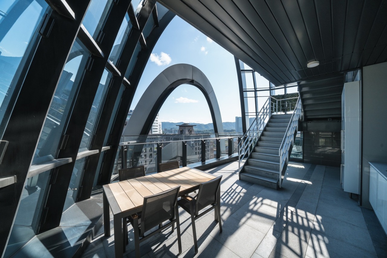 The office building's rounded, layered design results in architecture, building, daylighting, house, interior design, property, real estate, room, black