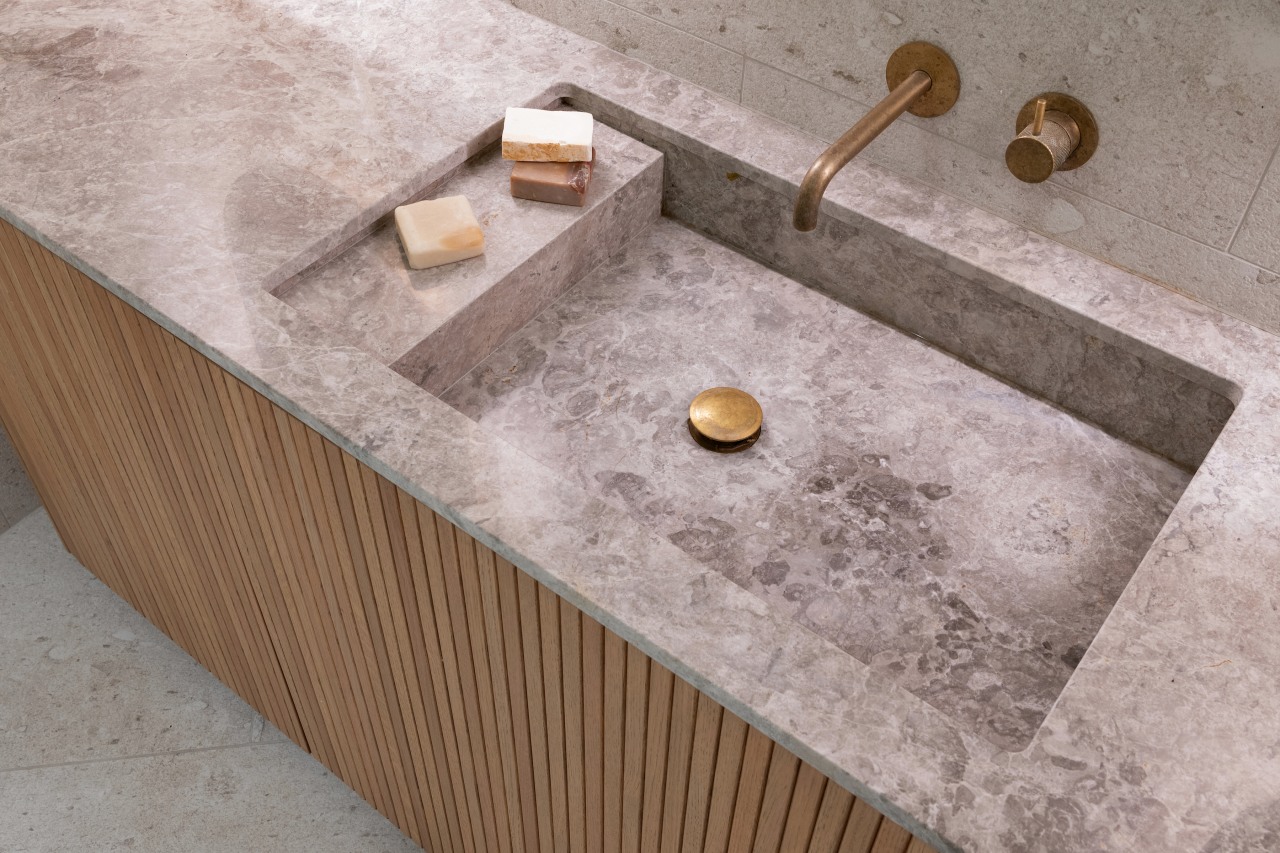 Created from the same travertine as the benchtop, 