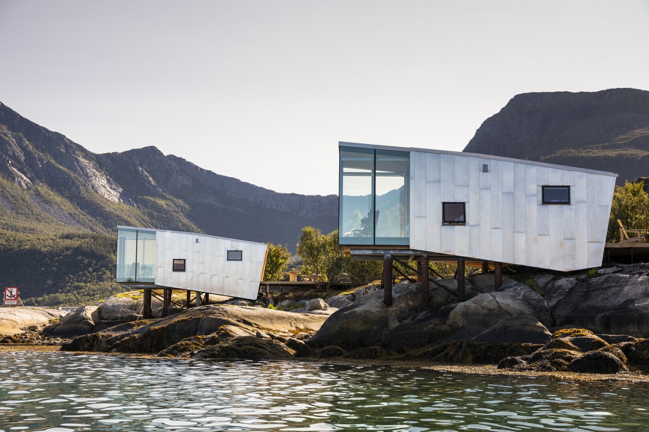 For the Manshausen 2.0, a recent extension of architecture, bay, coast, coastal and oceanic landforms, fell, fjord, geological phenomenon, highland, hill, home, house, inlet, landscape, mountain, rock, sea, sky, water, white