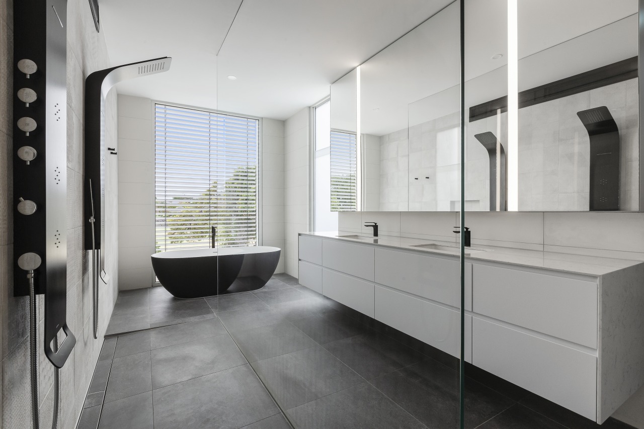 Pared back and sculptural, this bathroom boasts several 