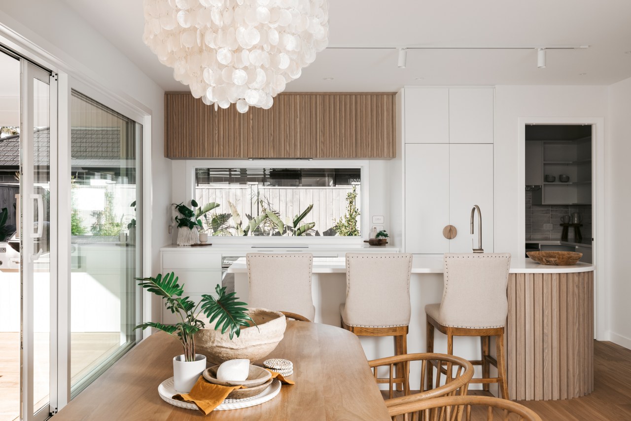 The wood crafted kitchen is complemented by timber 