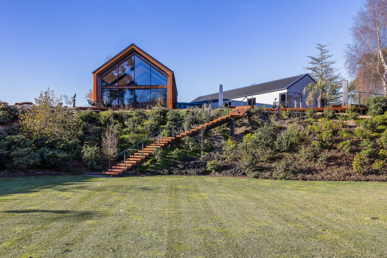 From the deck, timber steps lead down a 