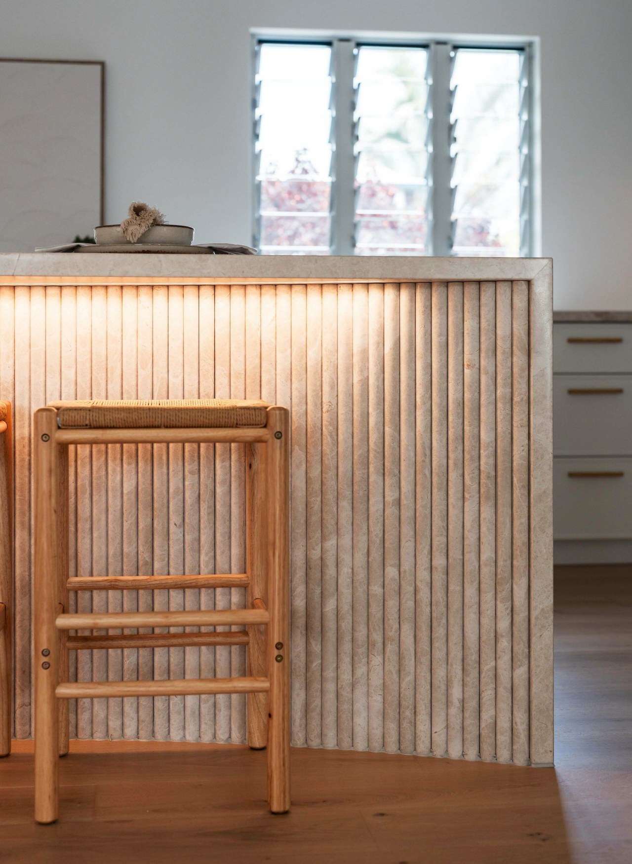 A fluted stone detail on the island adds 