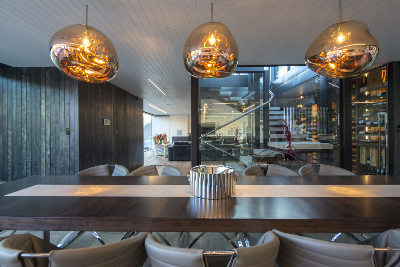 ​​​​​​​Sculptural pendants over the dining table reflect the interior design, pendants, Gary Todd Architecture, kitchen