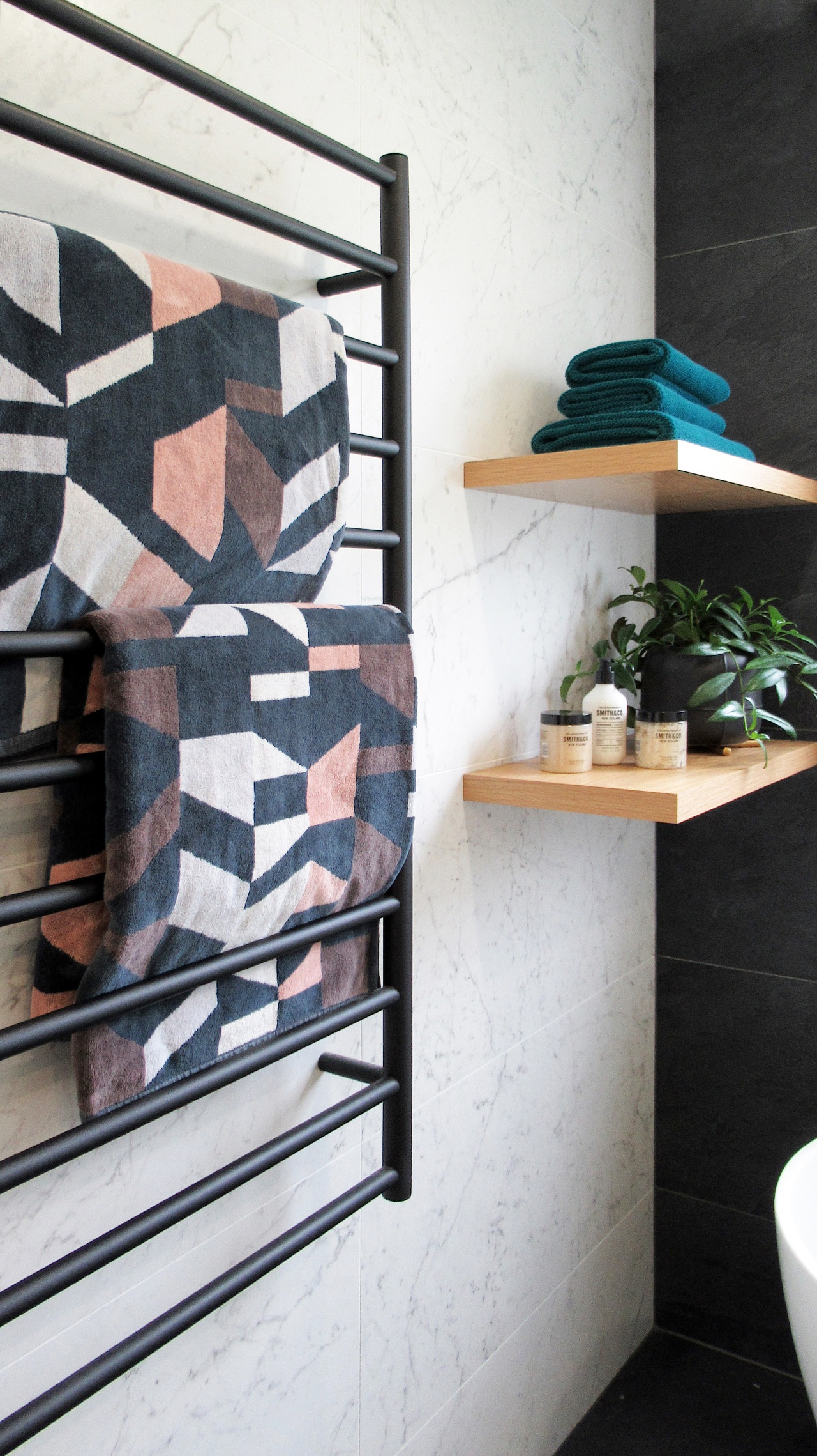 The timber floating shelves – along with the white, black