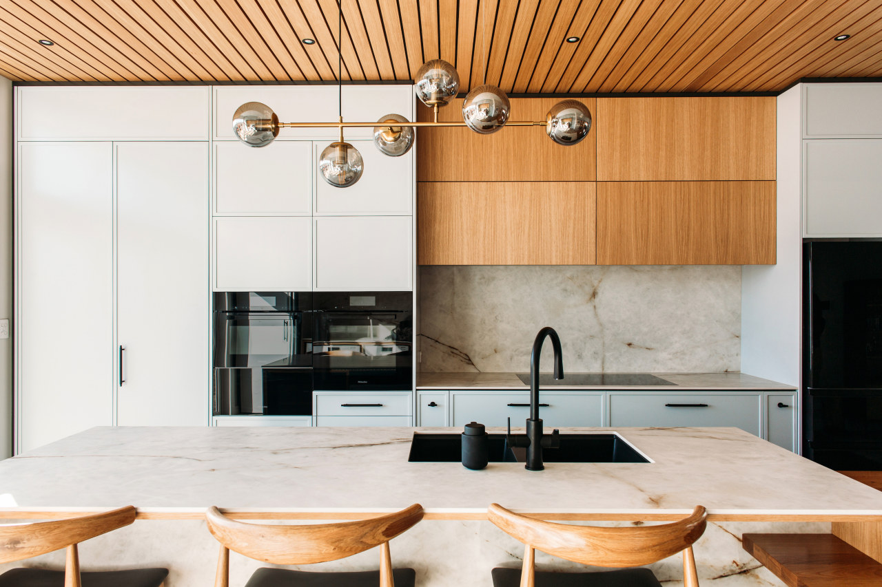 A designer pendants set off the kitchen island. 