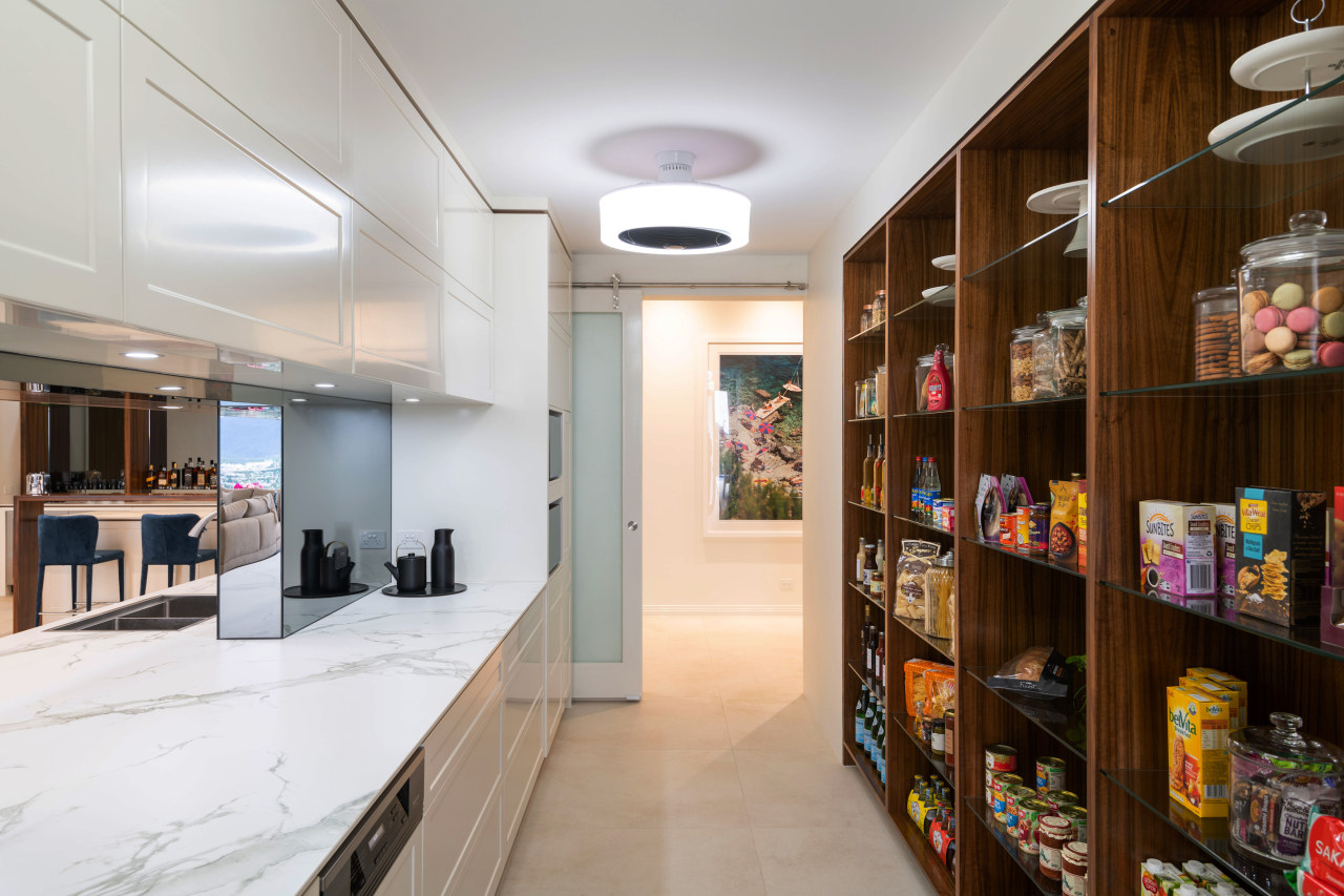 The spacious, well laid out pantry  complements the 