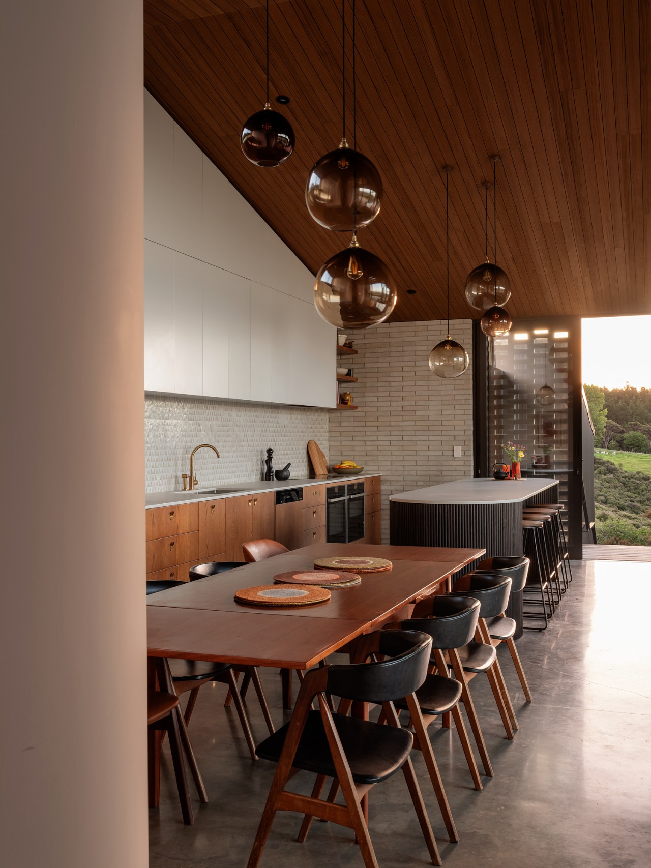 Looking across the dining area and kitchen to 