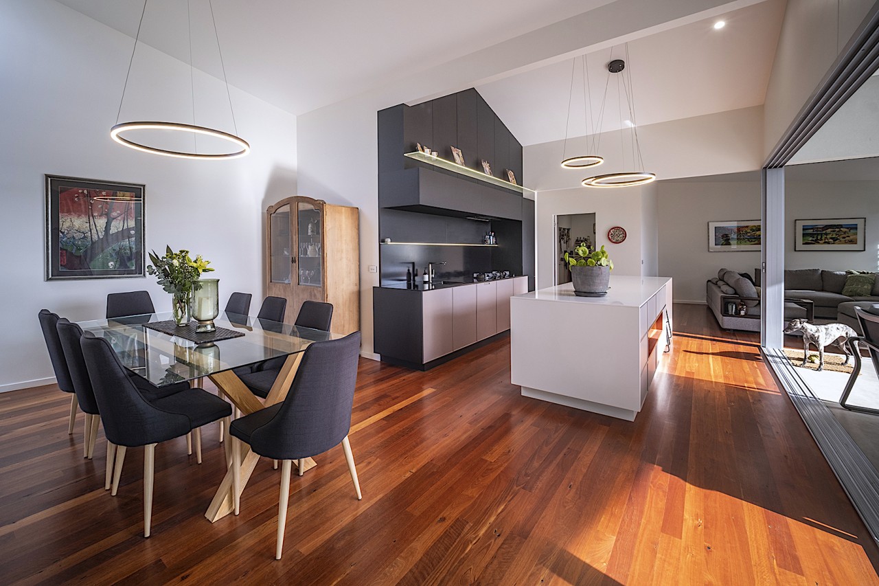 The timber floored living, kitchen and dining areas 