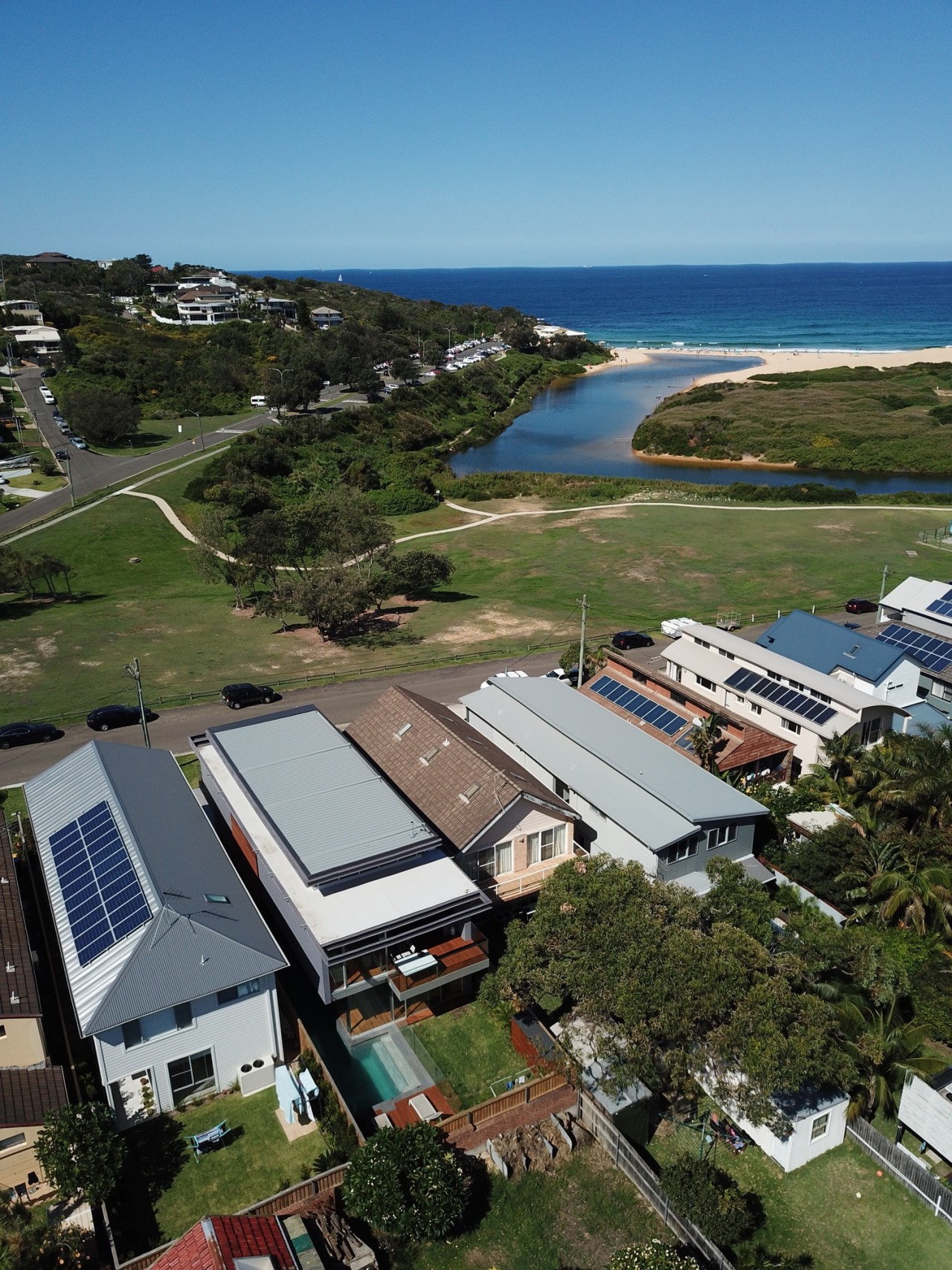 Looking out to see from the subdivision. aerial photography, bird's eye view, energy, home, house, photography, real estate, roof, sea, sky, water, brown