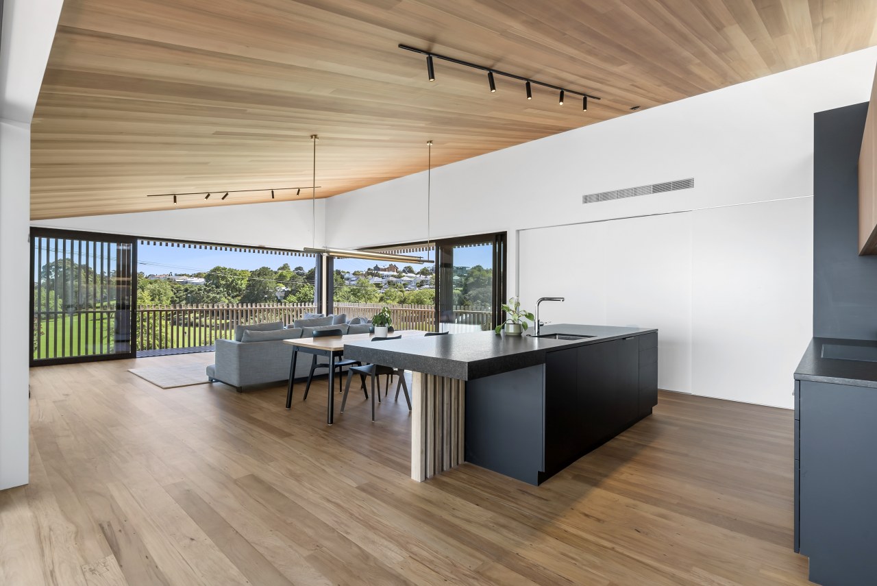 The kitchen island appears to float free in 