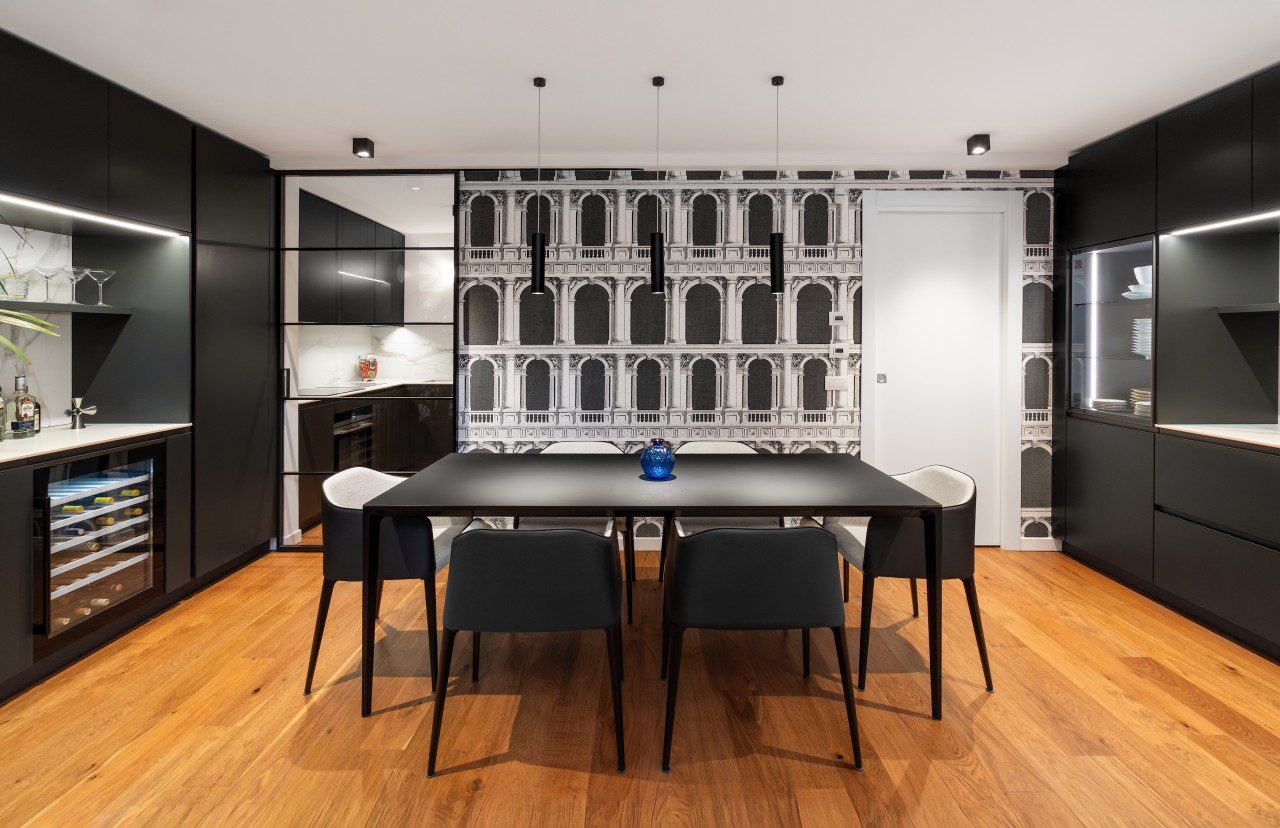 The dining area's black cabinetry with white elements 