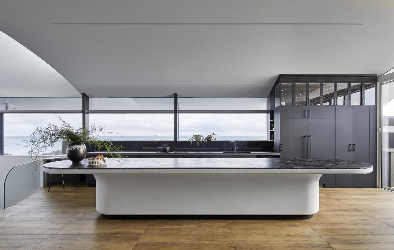 The kitchen island has its own nautical accent. 