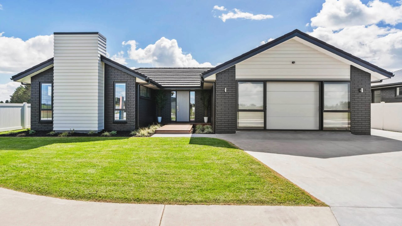 Complementary facade finishes give the home great street 