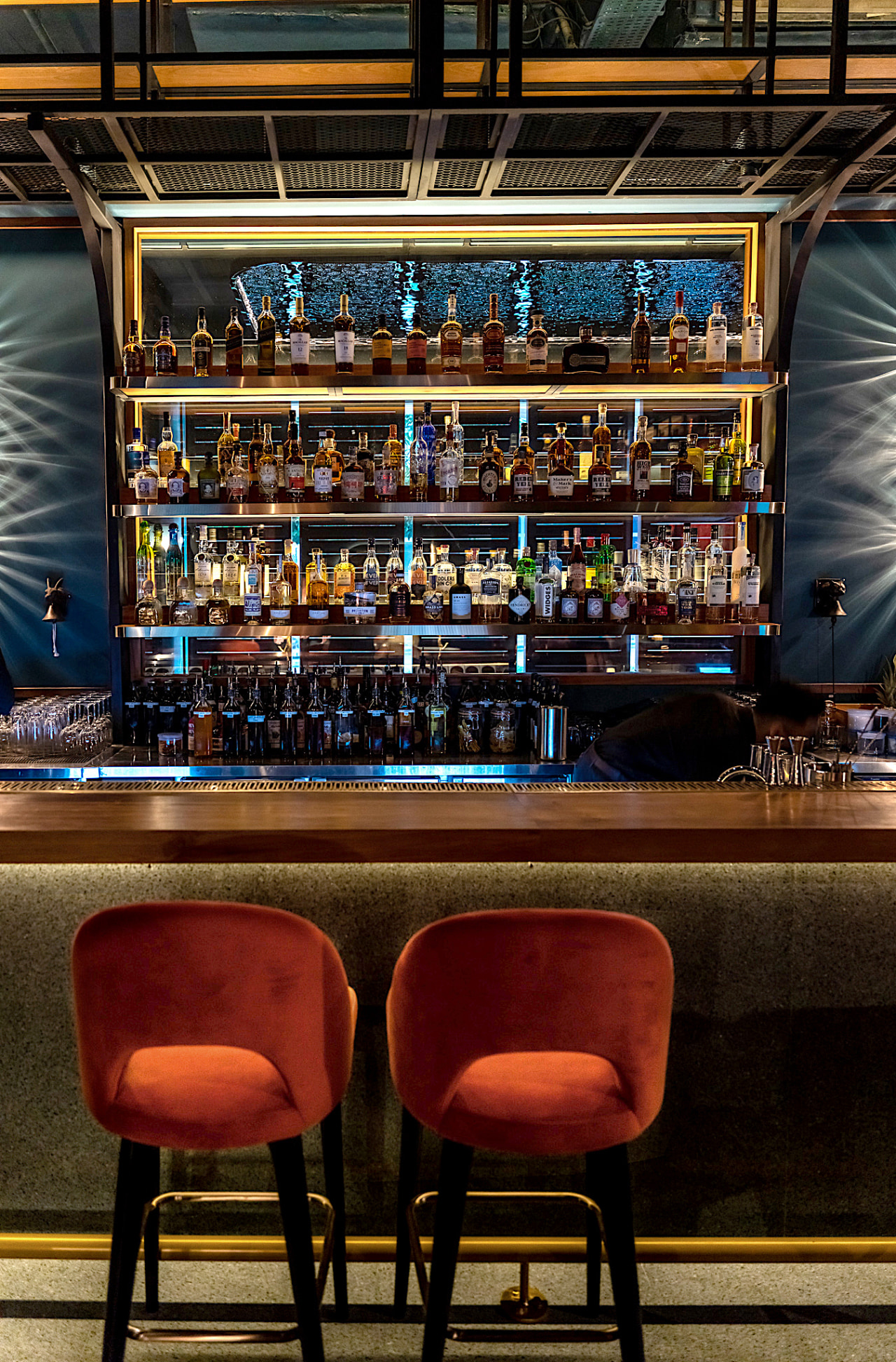 Detail of the main bar: behind the bottle-filled 