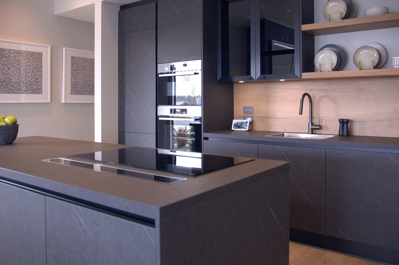 Dark cabinetry finishes are complemented by a generous 