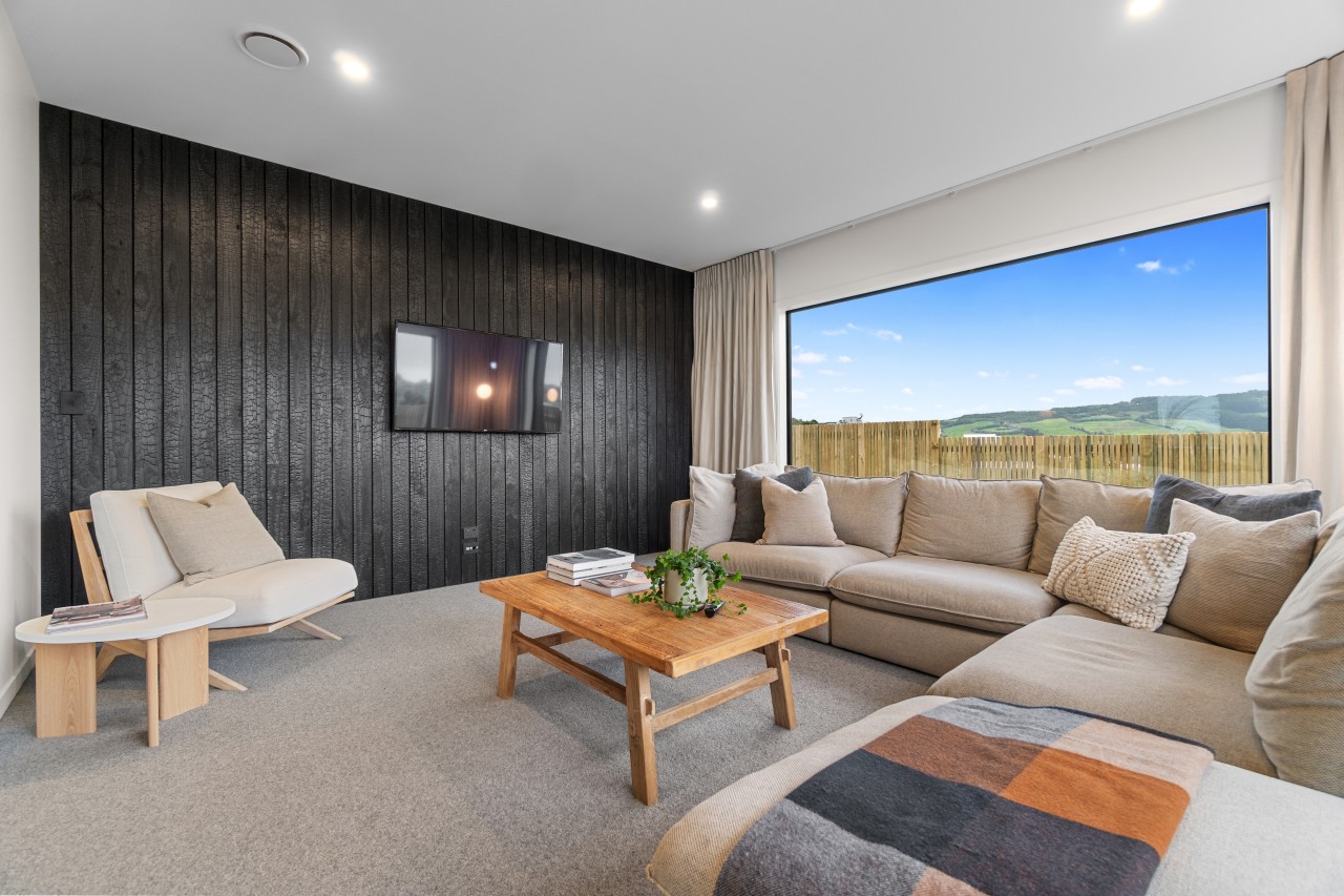 Media room with individualistic cladding brought inside as 