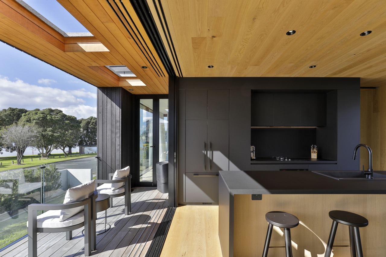 The covered deck includes skylights overhead. 