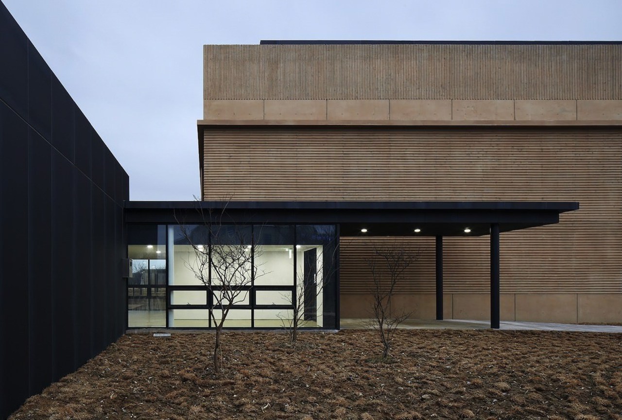The lobby is welcoming, with floor to ceiling architecture, building, daylighting, facade, house, black