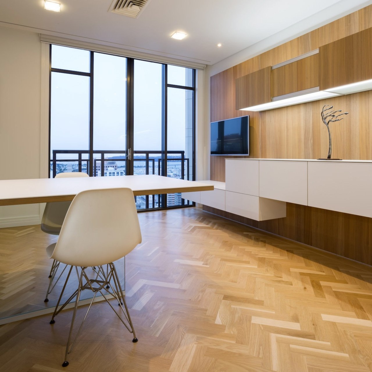 The clean design of the kitchen means uninterrupted architecture, ceiling, floor, flooring, furniture, hardwood, interior design, laminate flooring, table, wall, wood, wood flooring, gray