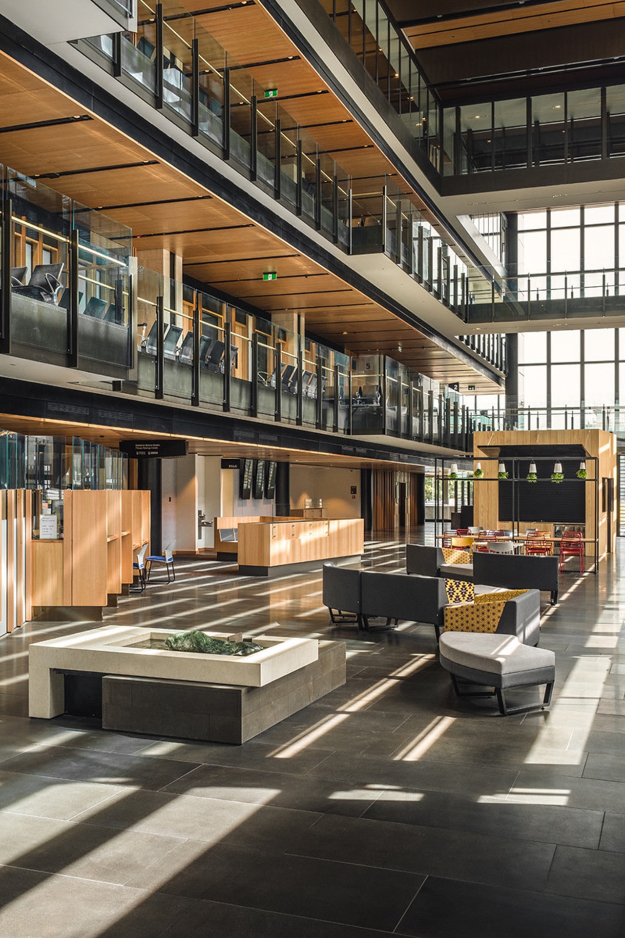 Home to the public cafe, the glass-walled atrium architecture, building, black