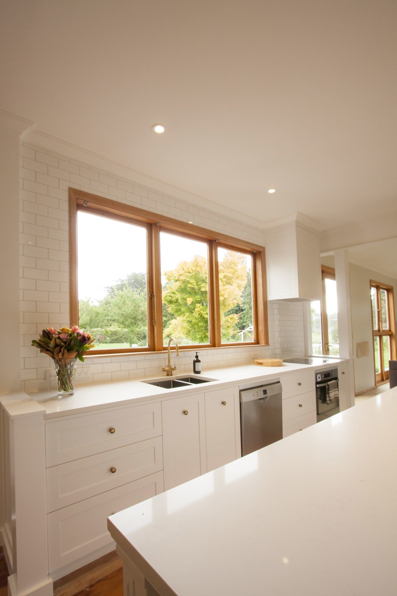 TIDA NZ 2017 – Designer kitchen entrant – cabinetry, ceiling, countertop, daylighting, floor, flooring, home, house, interior design, kitchen, real estate, room, sink, window, gray, brown