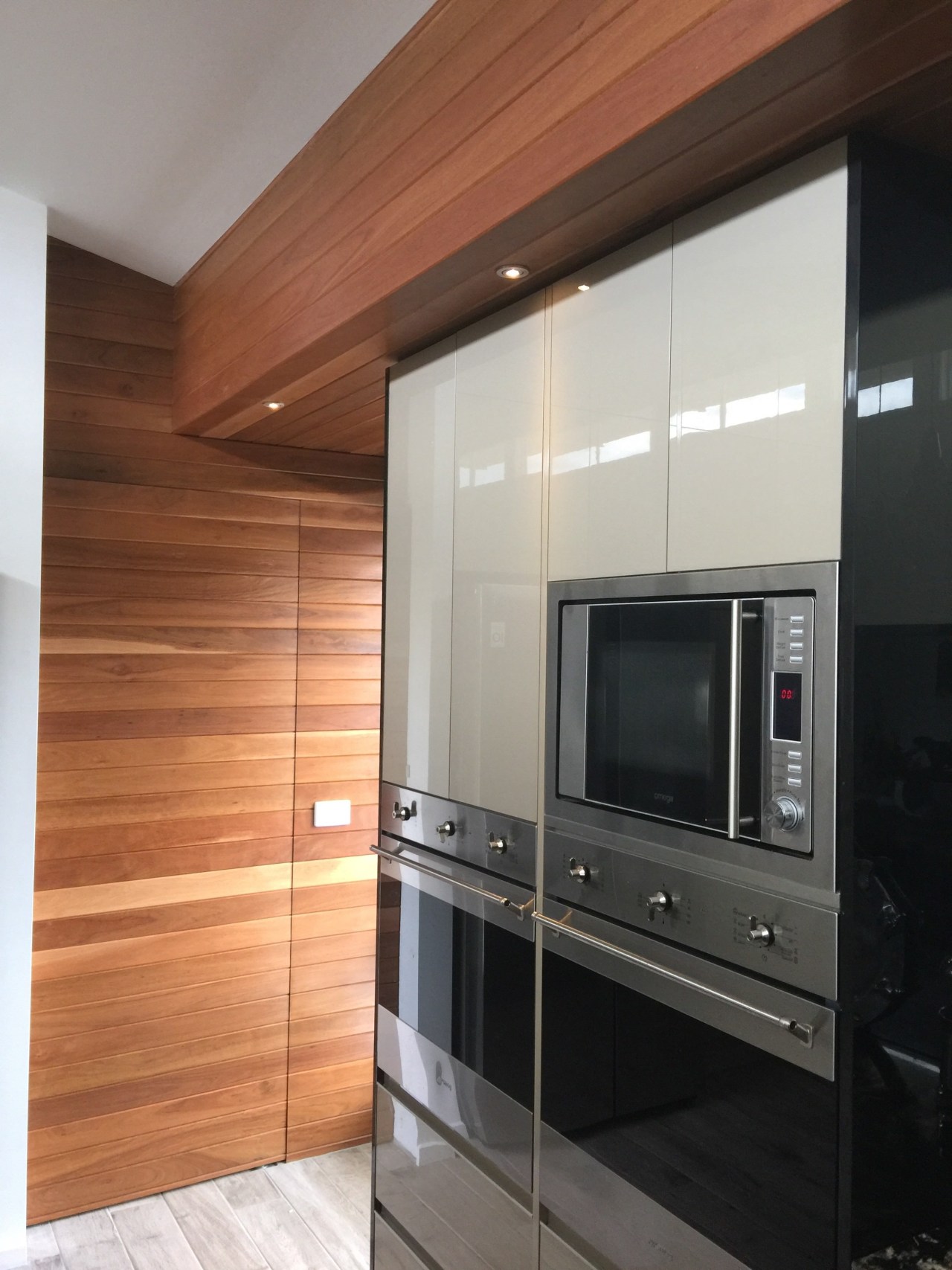 Centre Stage cabinetry, countertop, floor, flooring, home appliance, interior design, kitchen, major appliance, wood flooring, gray, brown