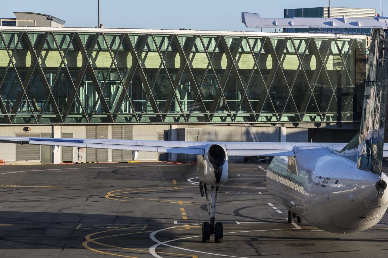 WLG International Airport Terminal South South Expansion - aerospace engineering, air travel, aircraft, aircraft engine, airline, airliner, airplane, airport, airport apron, airport terminal, atmosphere of earth, aviation, jet bridge, narrow body aircraft, wide body aircraft, black, gray