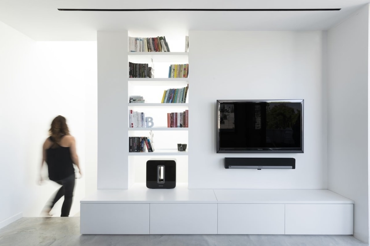 This living room wall features a bookshelf and bookcase, furniture, interior design, product design, shelf, shelving, white