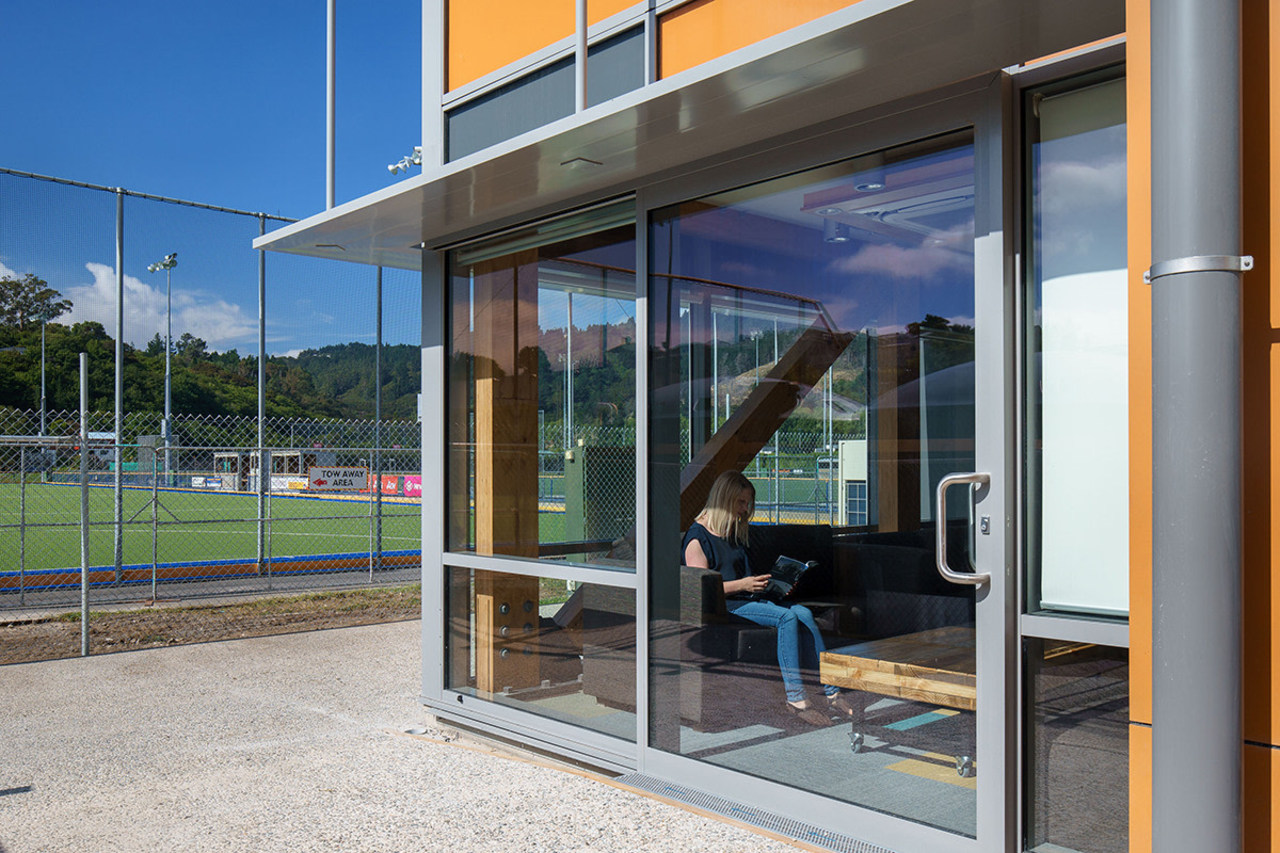 Connections to the outdoors and plenty of natural door, facade, glass, window, gray