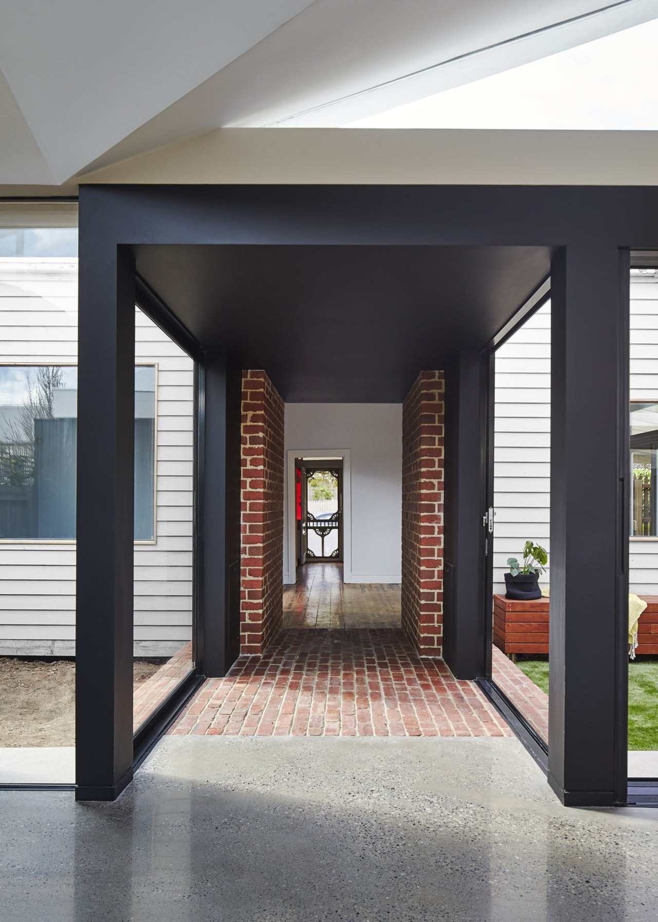 Looking through the tunnel into the old part architecture, door, floor, interior design, lobby, structure, black, gray, white