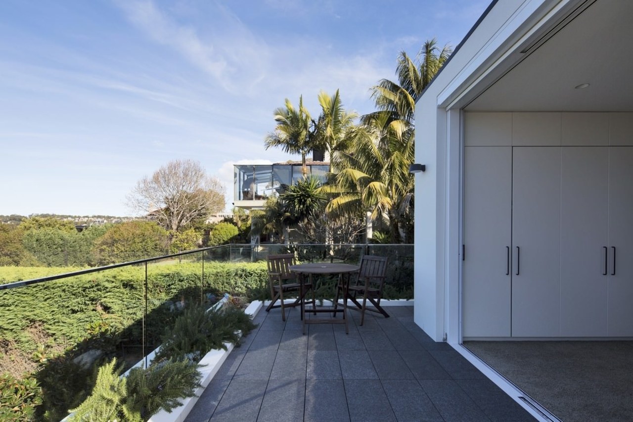 This balcony features a glass balustrade and views architecture, cottage, estate, facade, home, house, property, real estate, residential area, villa, teal