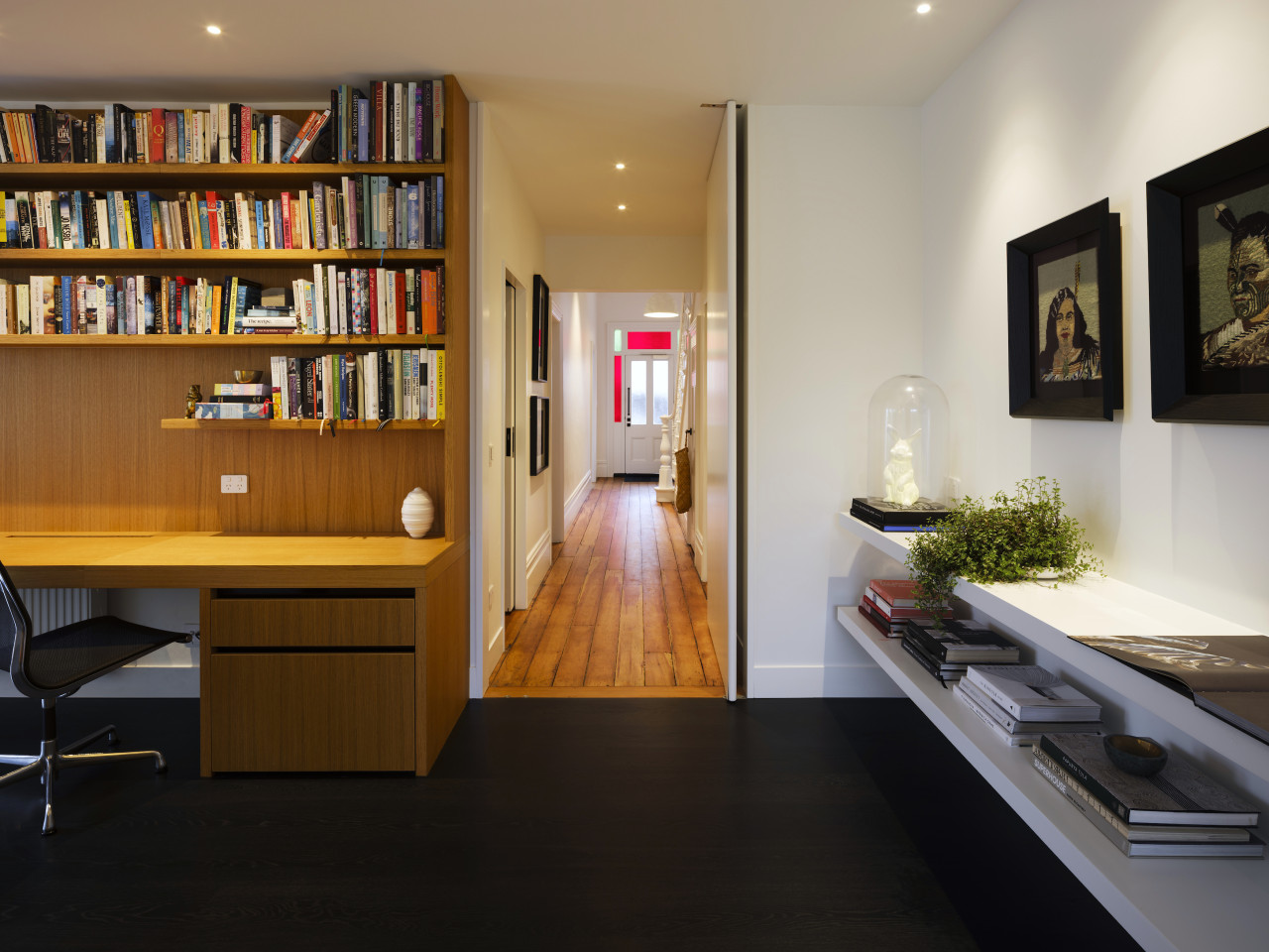 The entry hall has rich wood flooring – 