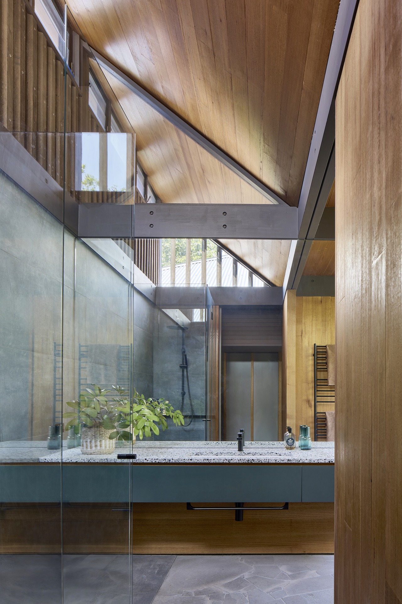 Main bathroom with giant mirror and stone benchtop 