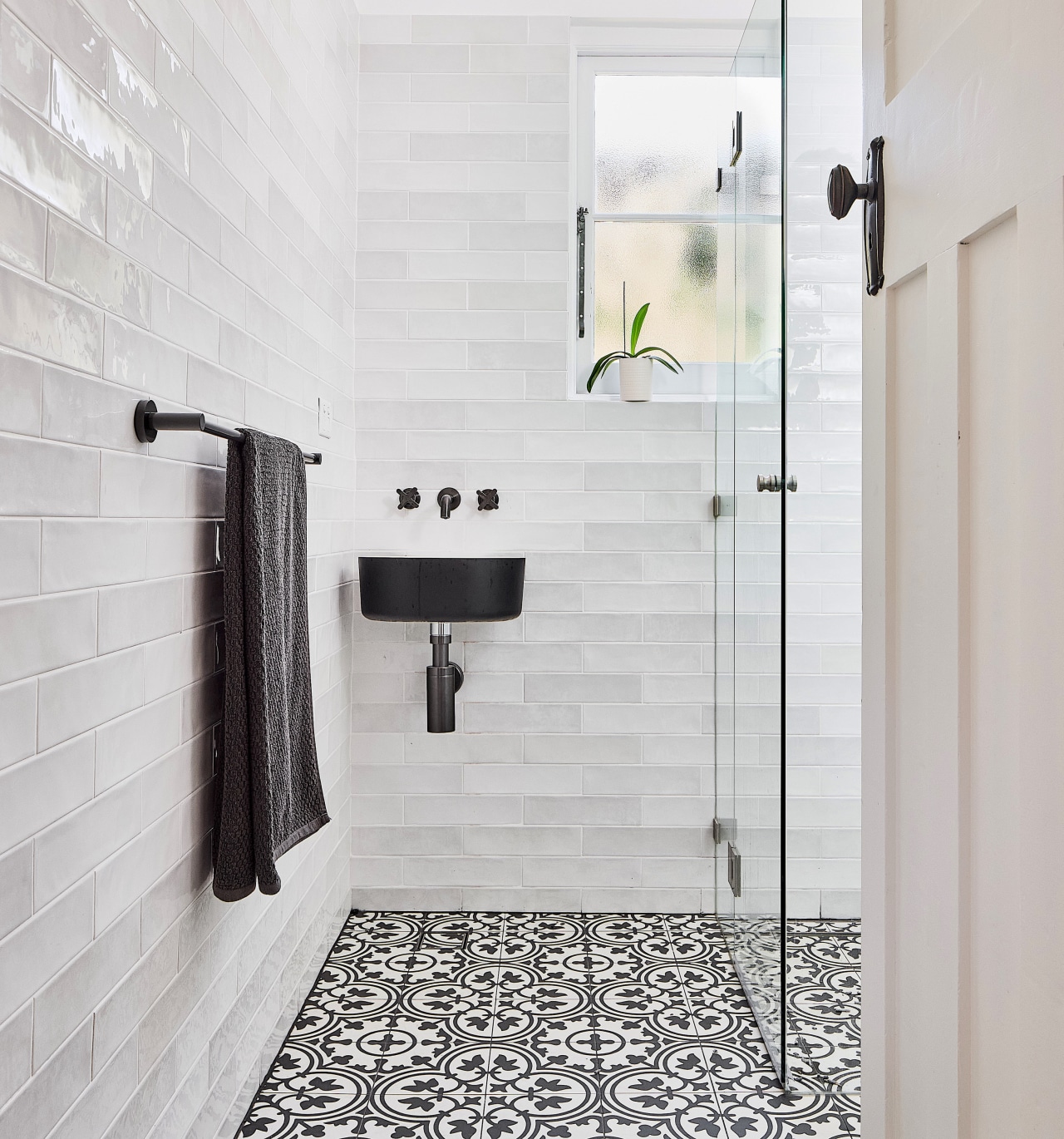 The ground floor bathroom features a playful mix 