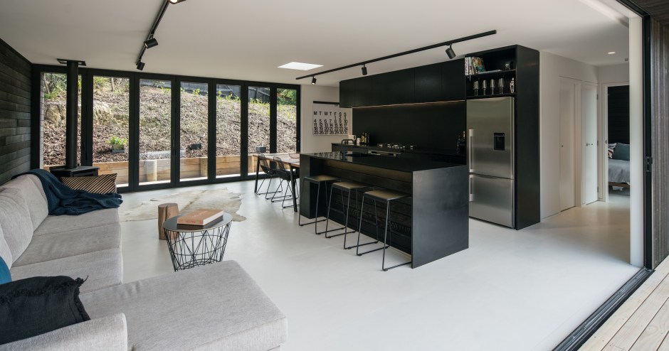 Black minimalist kitchen in compact holiday home