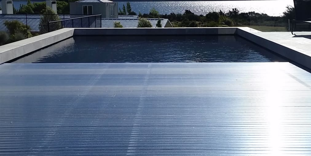 Automated Pool Cover Saves Money And Minimises Trends Automated Pool Cover Saves Money And, Pool Ground Cover Nz