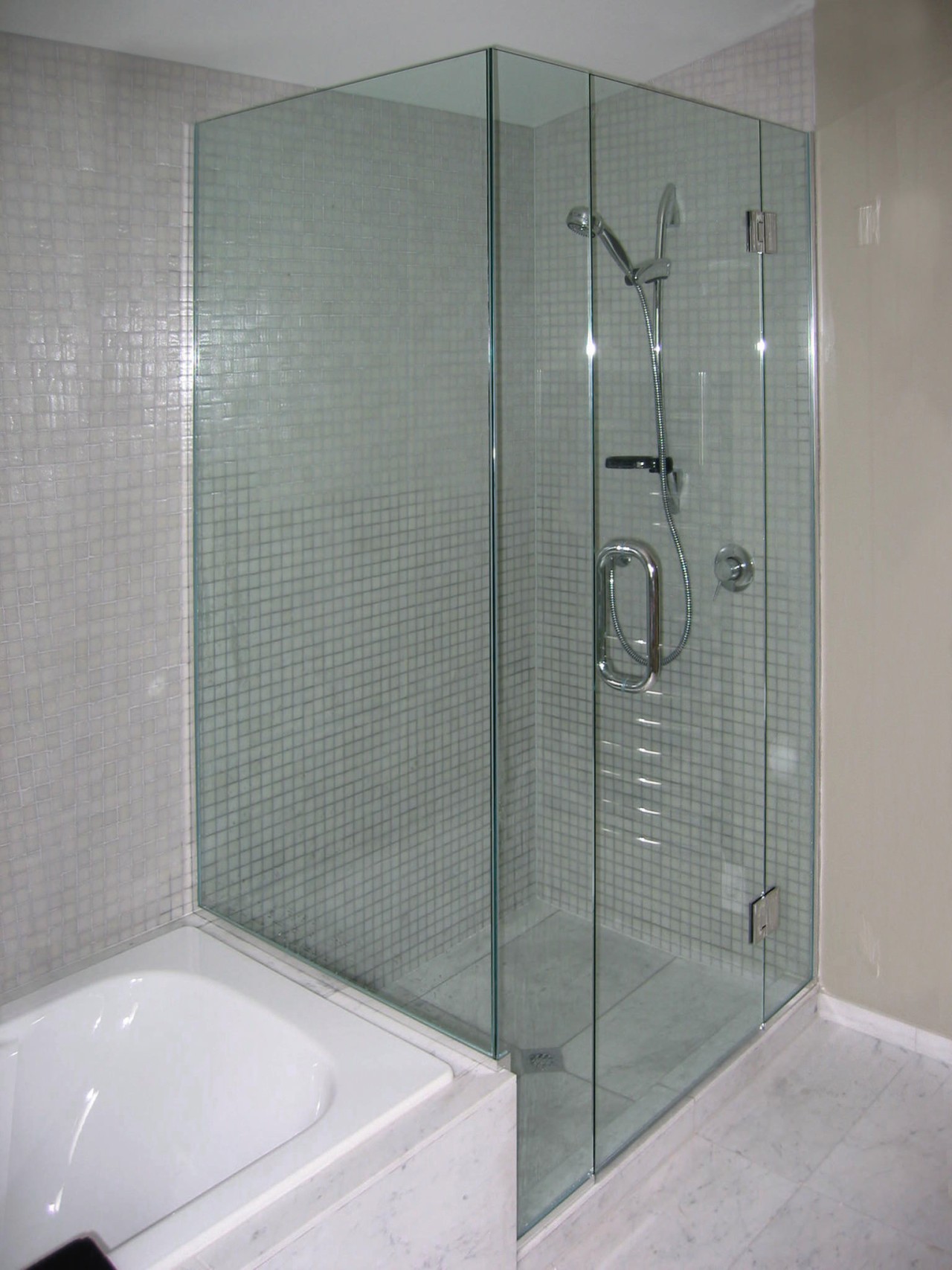 The detail of a shower bathroom, glass, plumbing fixture, shower, shower door, tile, gray