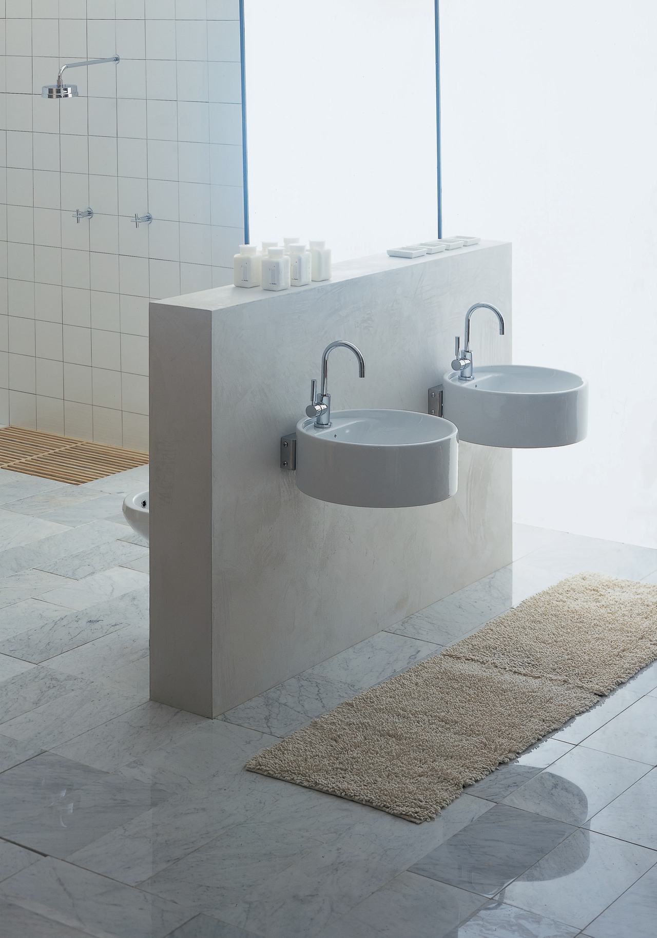 Bathroom: two round basins cantilevered out from a bathroom, bathroom sink, bidet, ceramic, floor, plumbing fixture, product design, tap, gray, white