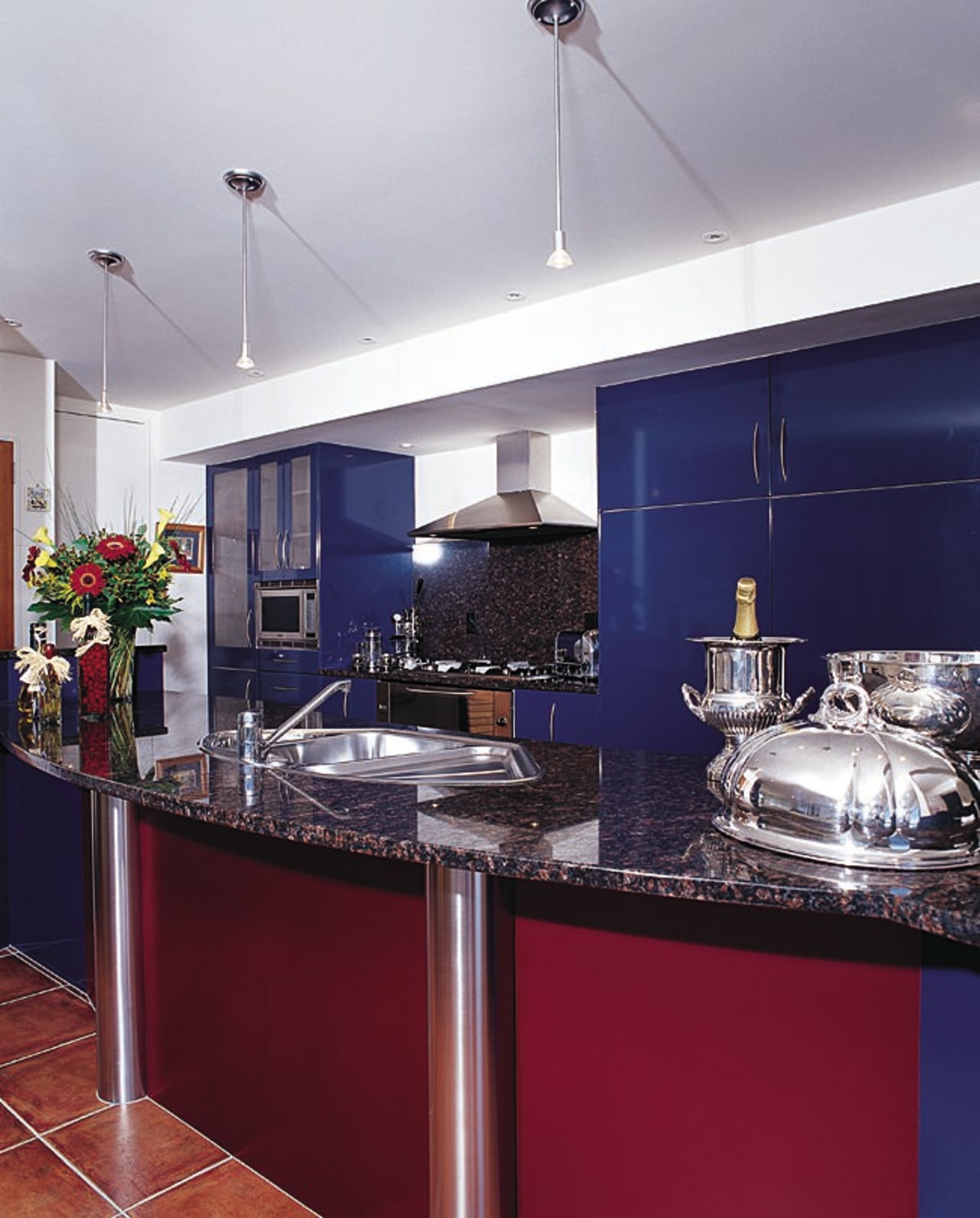 A kitchen that is strong on looks countertop, interior design, kitchen, real estate, gray, red