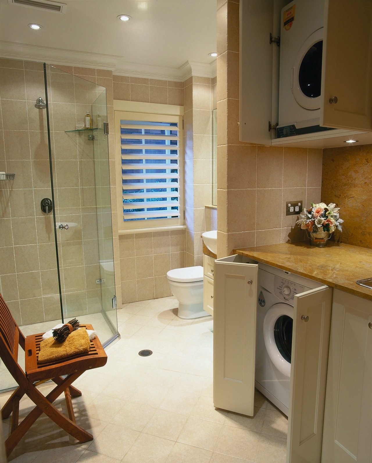 The view of a bathroom combined with a bathroom, countertop, floor, flooring, home, interior design, kitchen, property, room, tile, wall, brown, orange