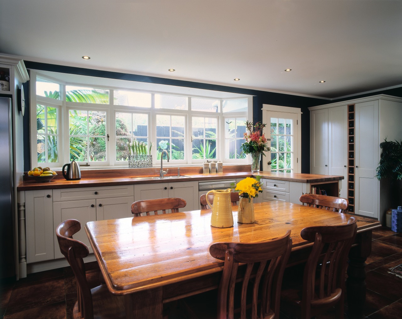 The view of a traditional styled kitchen countertop, dining room, interior design, kitchen, property, real estate, room, table, window, gray, black