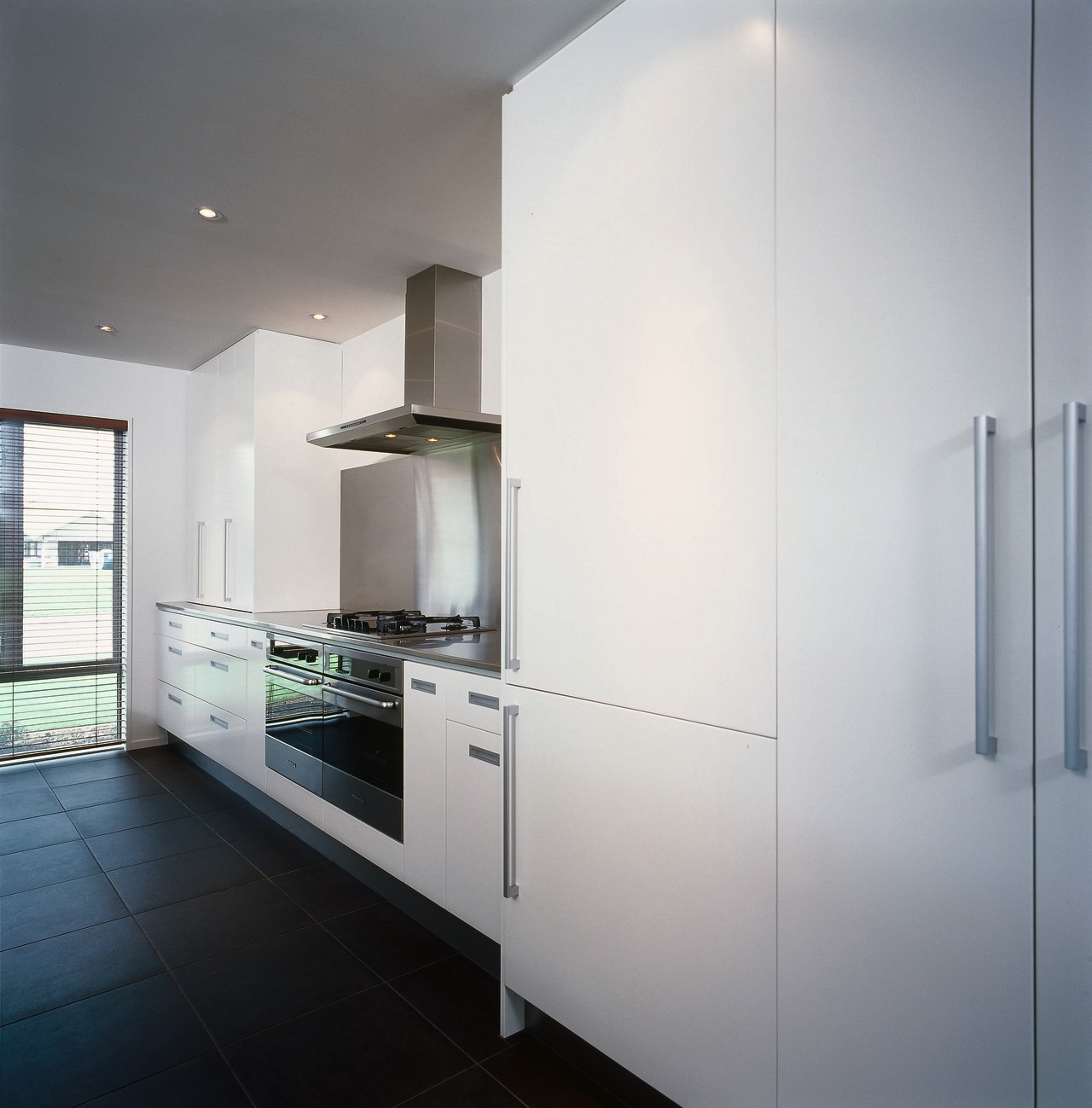 Kitchen with white walls and cabinetry, full height architecture, cabinetry, countertop, home appliance, interior design, kitchen, real estate, room, gray, white