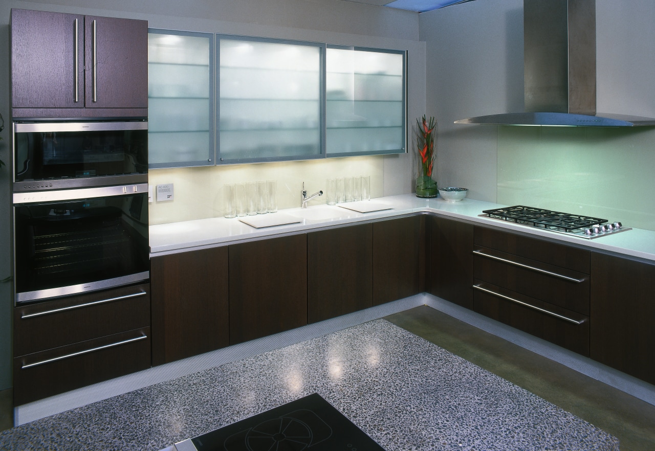 Kitchen with dark cabinetry and white benchtops, stainless cabinetry, countertop, interior design, kitchen, room, gray, black