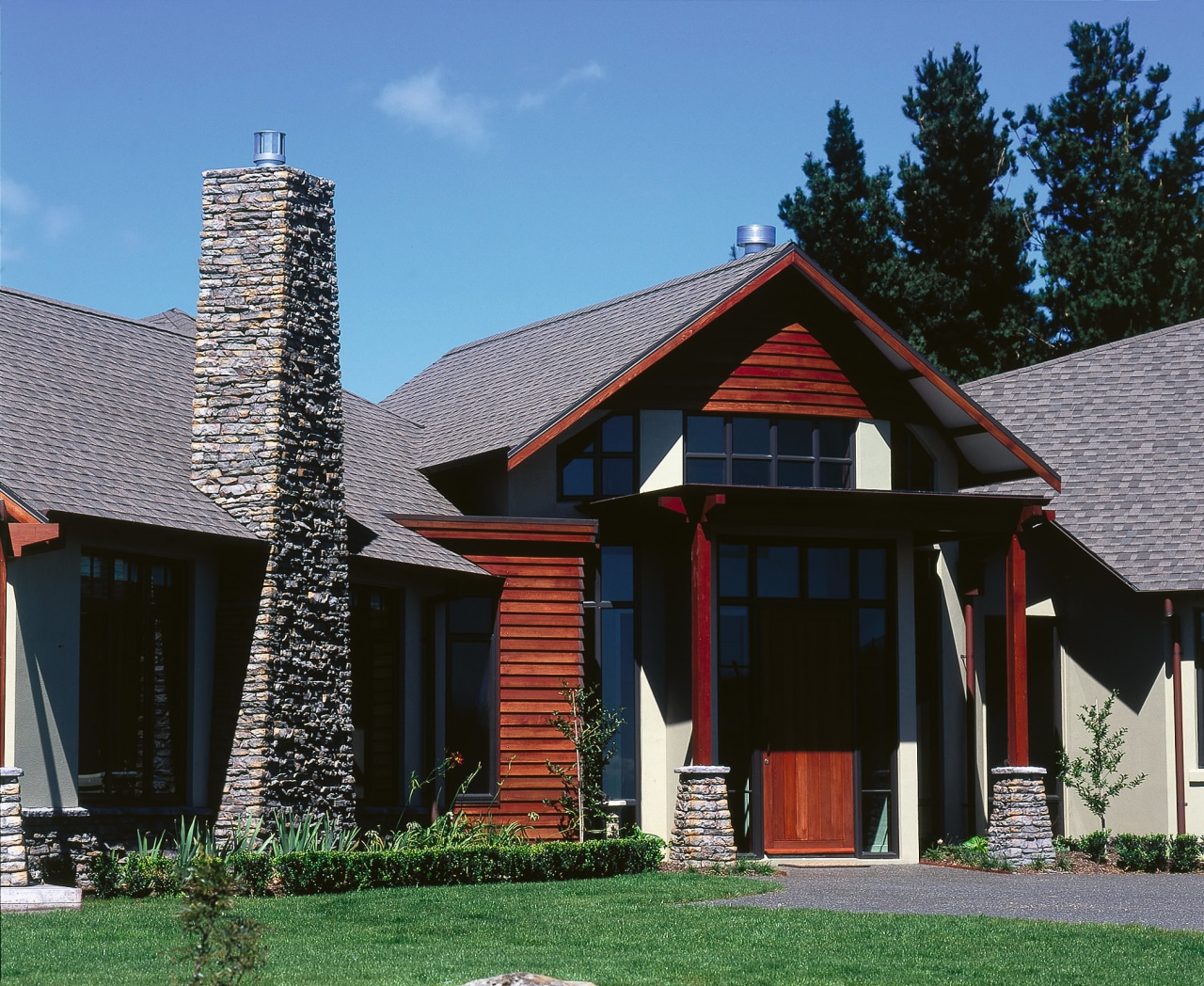 A photograph of the entrance of a rural architecture, building, cottage, elevation, estate, facade, farmhouse, historic house, home, house, outdoor structure, real estate, residential area, roof, siding, window, wood, black