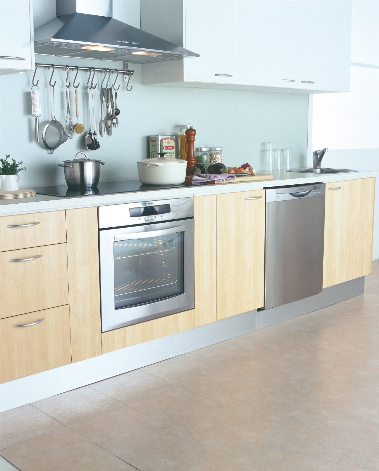 A photograph of a kitchen featuring Westinghouse kitchen cabinetry, countertop, cuisine classique, floor, flooring, furniture, home appliance, interior design, kitchen, kitchen appliance, kitchen stove, major appliance, product design, gray, white