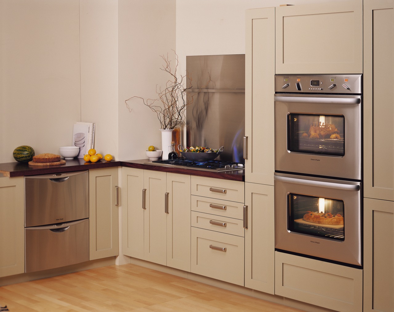 A kitchen featuring two Fisher &amp; Paykel ovens. cabinetry, countertop, cuisine classique, home appliance, kitchen, kitchen appliance, kitchen stove, major appliance, oven, refrigerator, room, orange, brown