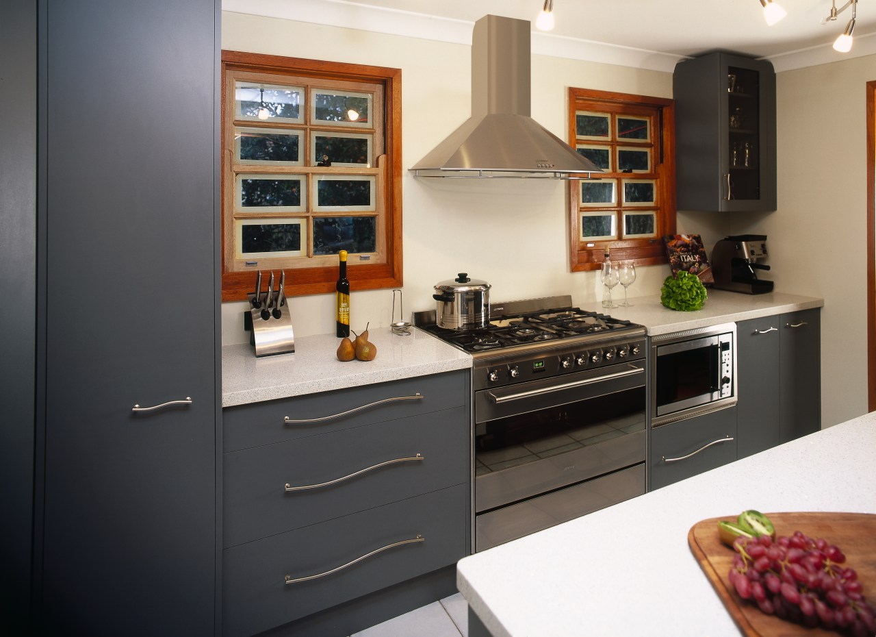 Kitchen with dark grey cabinetry and white benchtops cabinetry, countertop, cuisine classique, home appliance, interior design, kitchen, kitchen appliance, kitchen stove, room, black