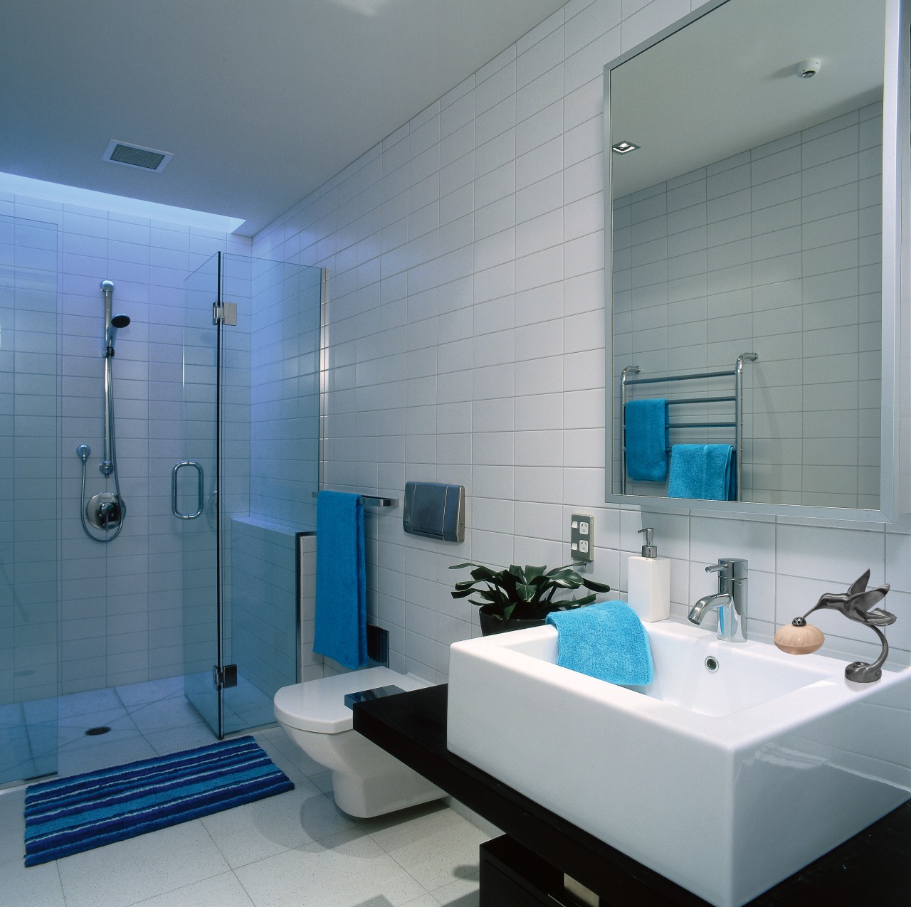 View of this bathroom bathroom, blue, ceiling, glass, interior design, plumbing fixture, room, tile, wall, gray