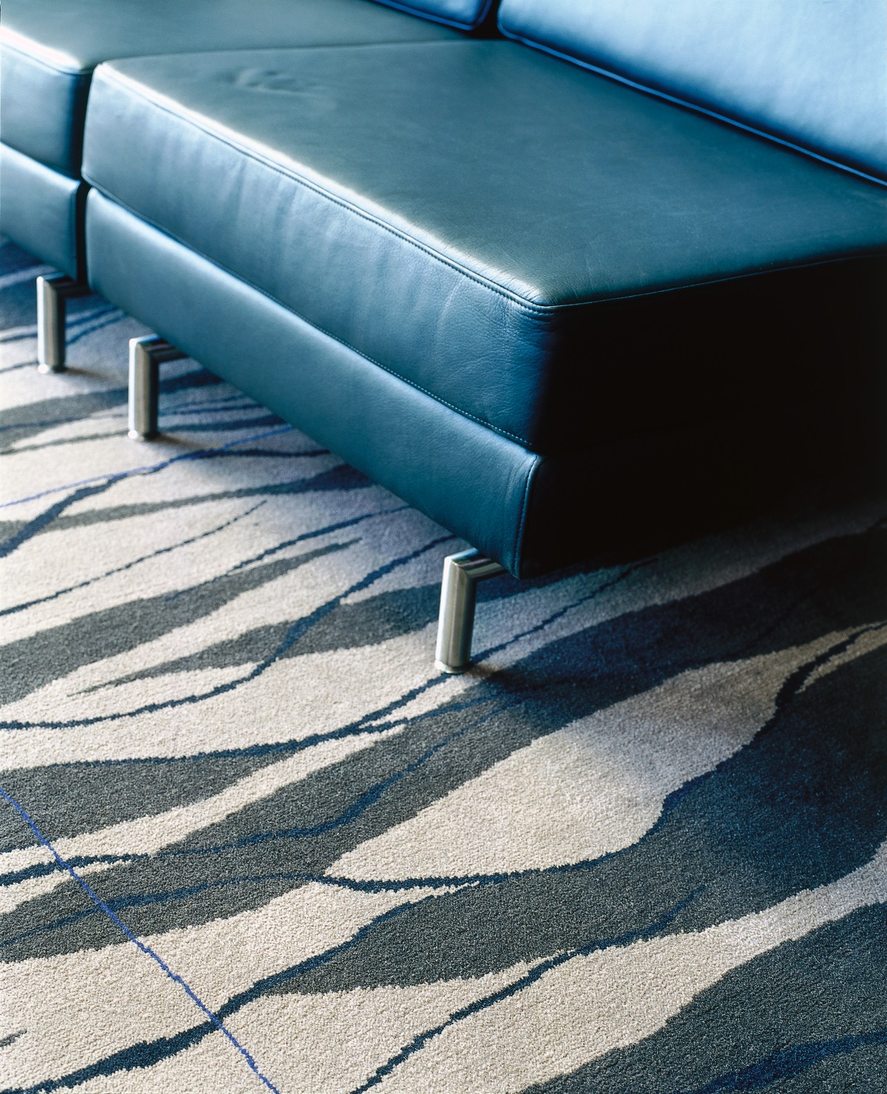 Black seats with stainless steel legs on patterned angle, blue, chair, floor, flooring, furniture, hardwood, line, outdoor furniture, wood, teal, black